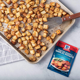 Potatoes in the oven with McCormick seasoning for crisp, savory edges.