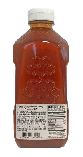 McCoy's Honey Orange Blossom pour in a glass bottle, ideal for tea and yogurt.