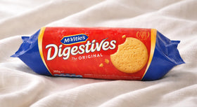 Digestive biscuits closeup reveals wholemeal texture and crisp bite.