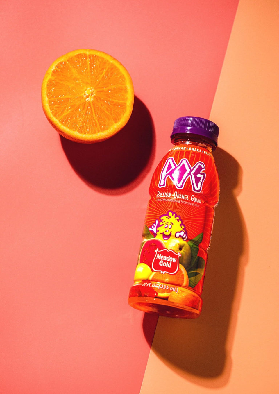 Meadow Gold POG juice 12oz bottle front view for a refreshing tropical sip.