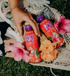 Meadow Gold POG juice six-pack case shown on a shelf for on-the-go sharing.