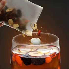 Megacephalus Six Treasure Tea visible herbs invite mindful sipping.