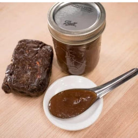 Mekoman Tamarind Paste texture closeup emphasizing smooth paste for easy mixing.