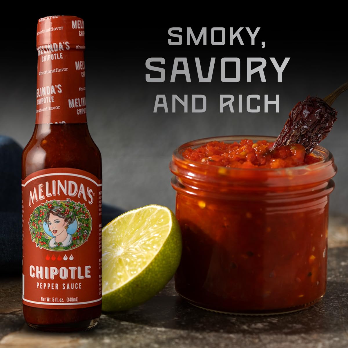 Fresh carrot visible in Melinda's Chipotle hot sauce packaging.