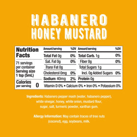 Melinda’s Habanero Honey Mustard dipping sauce beside crispy chicken nuggets