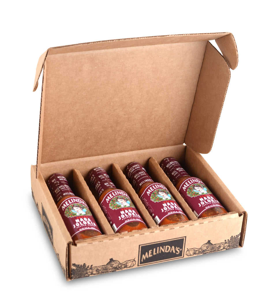 Melinda's Naga Jolokia bottle with bold, fruity heat, ready to elevate tacos and wings.