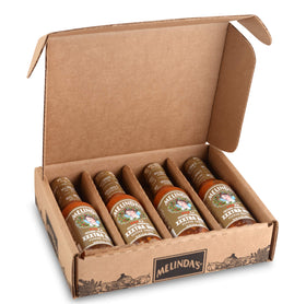 Melinda’s Original Habanero XXXtra Hot Sauce bottle with fresh peppers for balanced heat.