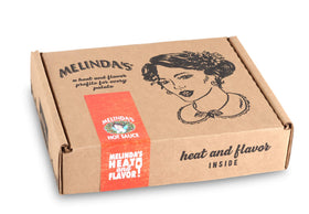 Pouring Melinda’s XXXtra Hot Sauce to add bright flavor to dishes.