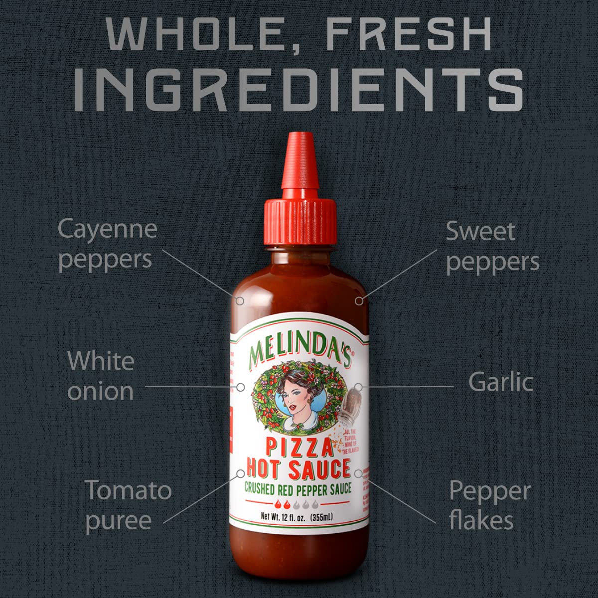 Close-up of Melinda's Pizza Hot Sauce ingredients highlighting garlic, tomatoes, and peppers.