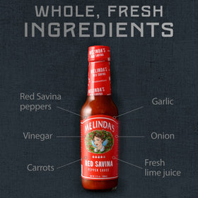 Pouring Melinda’s Red Savina onto fries to boost heat and flavor.