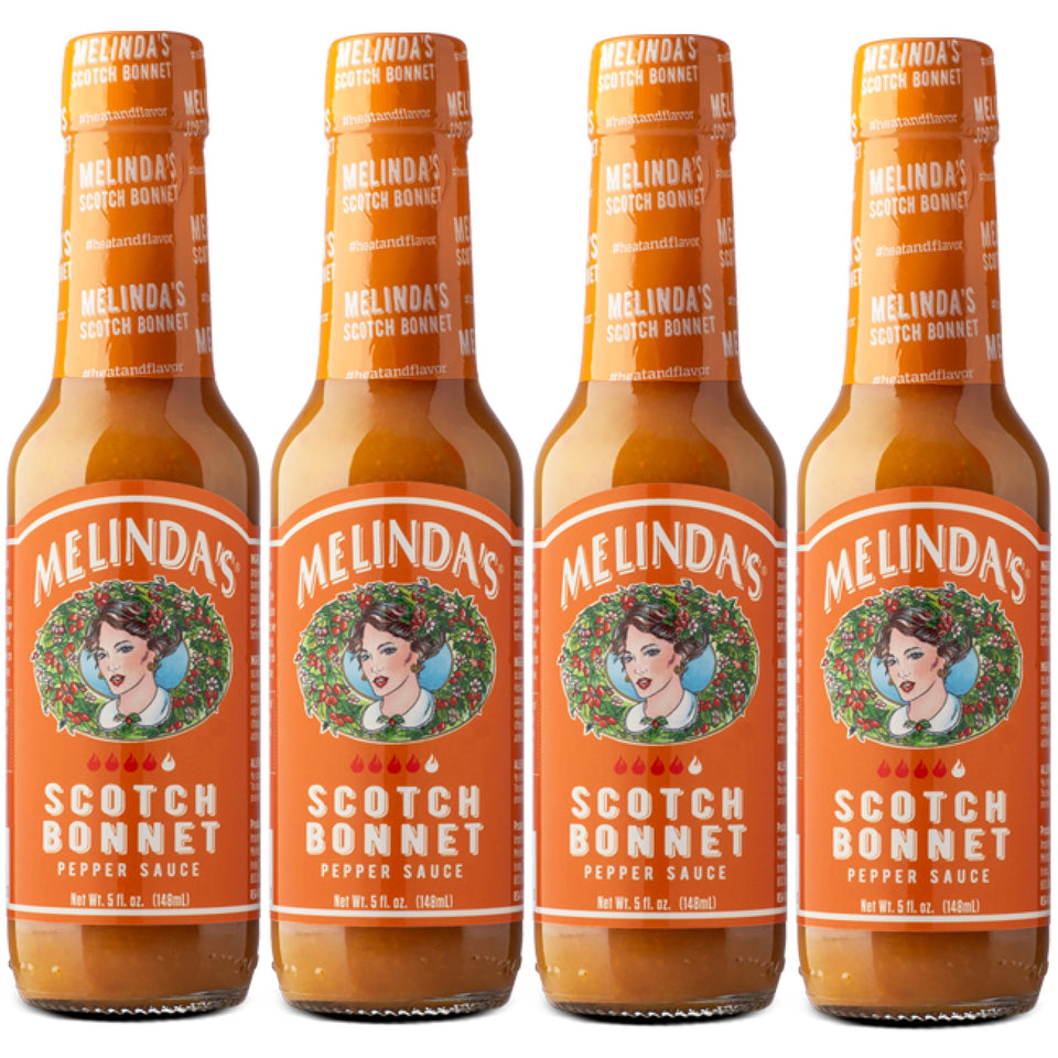 Melinda’s Scotch Bonnet hot sauce bottle ready to elevate grilled dishes.