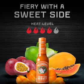 Melinda’s Scotch Bonnet hot sauce being poured for a quick flavor boost.