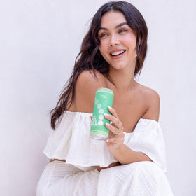 Melo Sparkling Kava Drink Tahitian Lime can being poured, ideal for social moments.