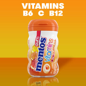 Mentos vitamins gum citrus piece closeup highlighting crunchy shell and soft center.