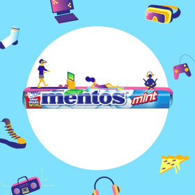 Pouring Mentos Mint Chewy Dragees bag into hand for quick refreshment