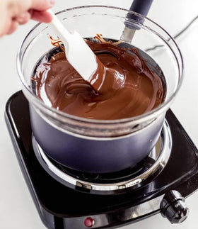Merckens Cocoa Lite wafers melted and poured for smooth molds.