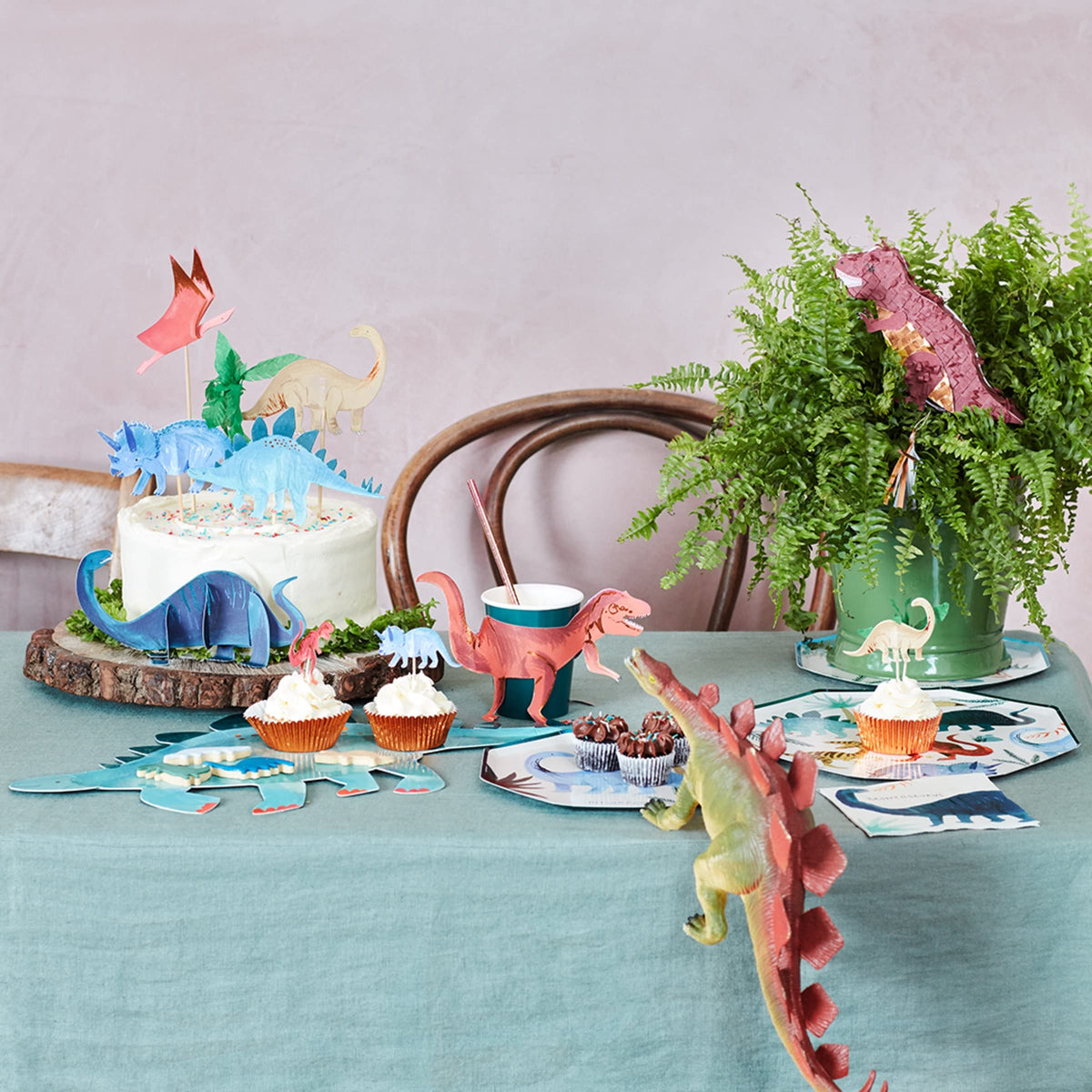 Meri Meri crepe-paper palm tree topper adds tropical flair and party-ready height.