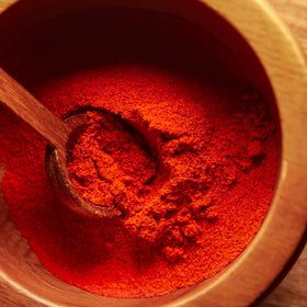 MEROPS paprika on kitchen counter with fresh ingredients for recipes.