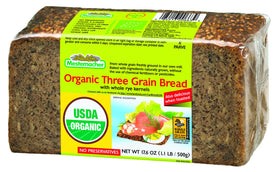 Mestemacher Whole Grain Bread, oven-fresh crust, organic three-grain loaf ideal for sandwiches.