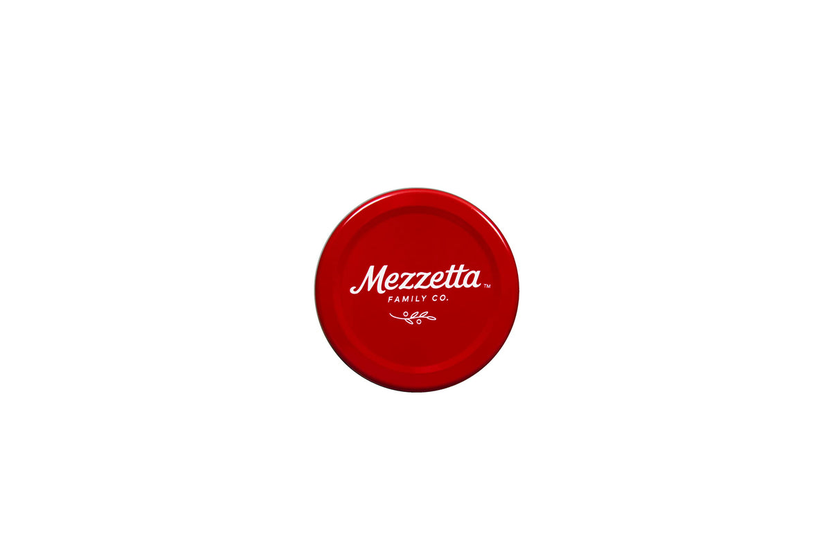Mezzetta garlic stuffed olives on a cheese board, perfect bite-sized flavor accents.