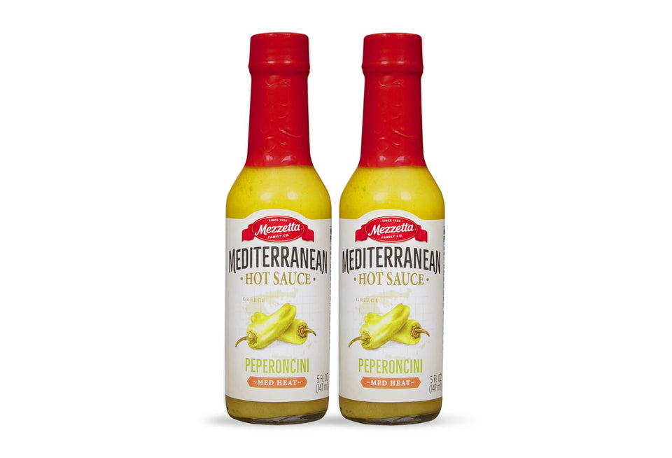 Mezzetta Peperoncini Sauce bottle close-up with Mediterranean heat for bold flavors.