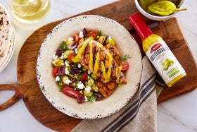 Mezzetta Peperoncini Sauce on pizza plate with cheese and tangy finish.