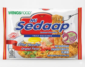 Mi Sedaap noodles-raw-dried-bundle shows essential ingredients for home cooking.