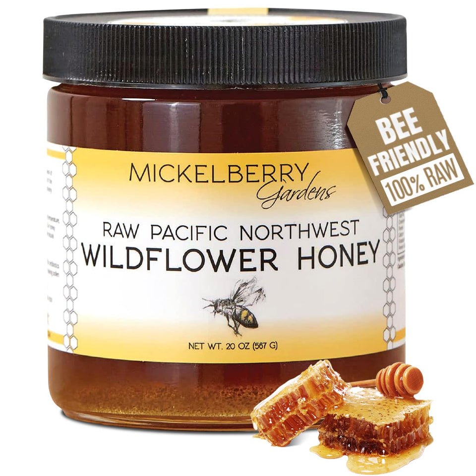 Mickelberry Gardens raw wildflower honey bottle pour shows smooth flow and purity.