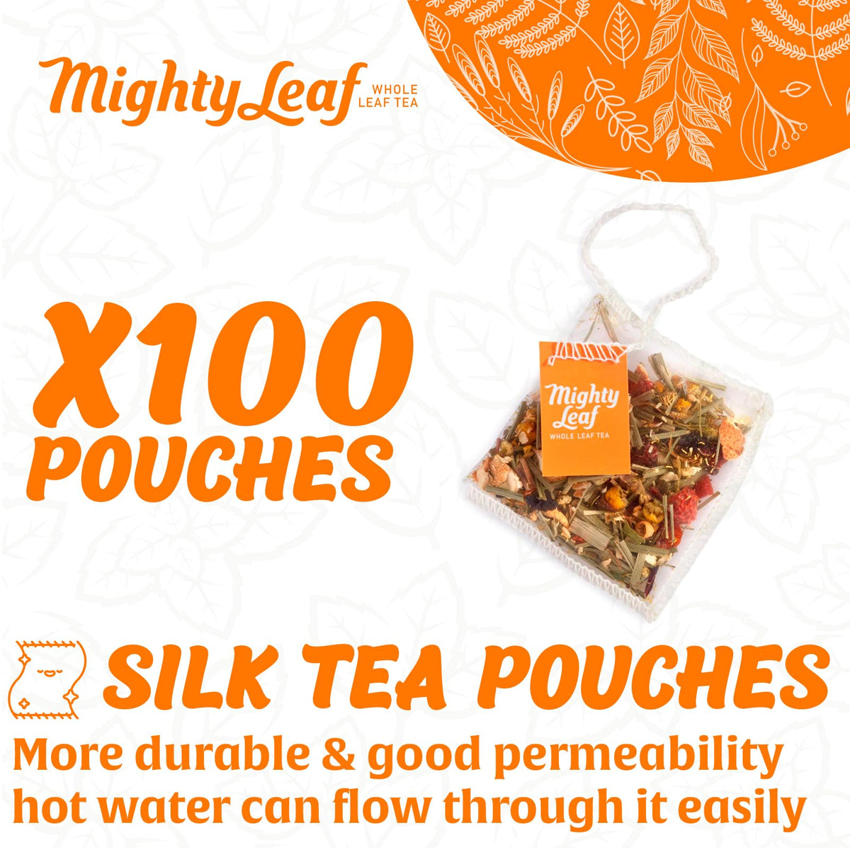 Mighty Leaf Chamomile Citrus pyramid pouch close-up reveals whole leaf blooms for rich flavor.