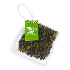 Mighty Leaf Organic Green Dragon Hangzhou-origin aroma in a clear cup.