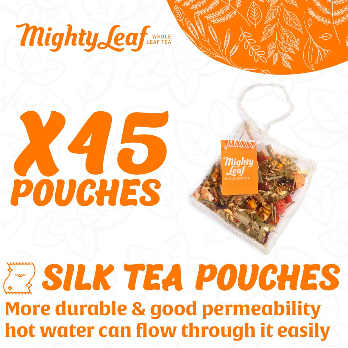 Close-up of Mighty Leaf pyramid tea bags revealing premium whole leaf blend.