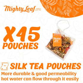 Close-up of Mighty Leaf pyramid tea bags revealing premium whole leaf blend.
