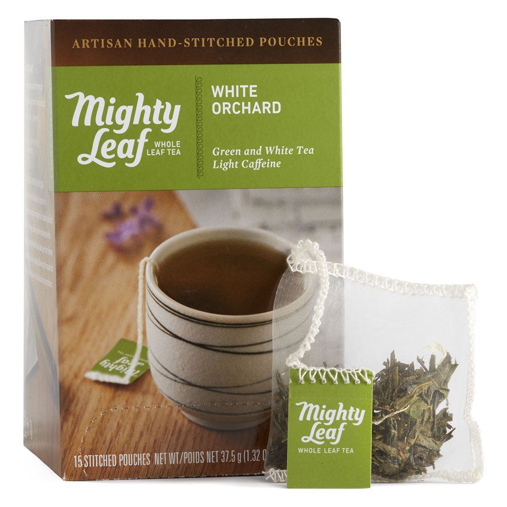 Mighty Leaf White Orchard tea bags showcasing whole leaf blend for a delicate fruity infusion.