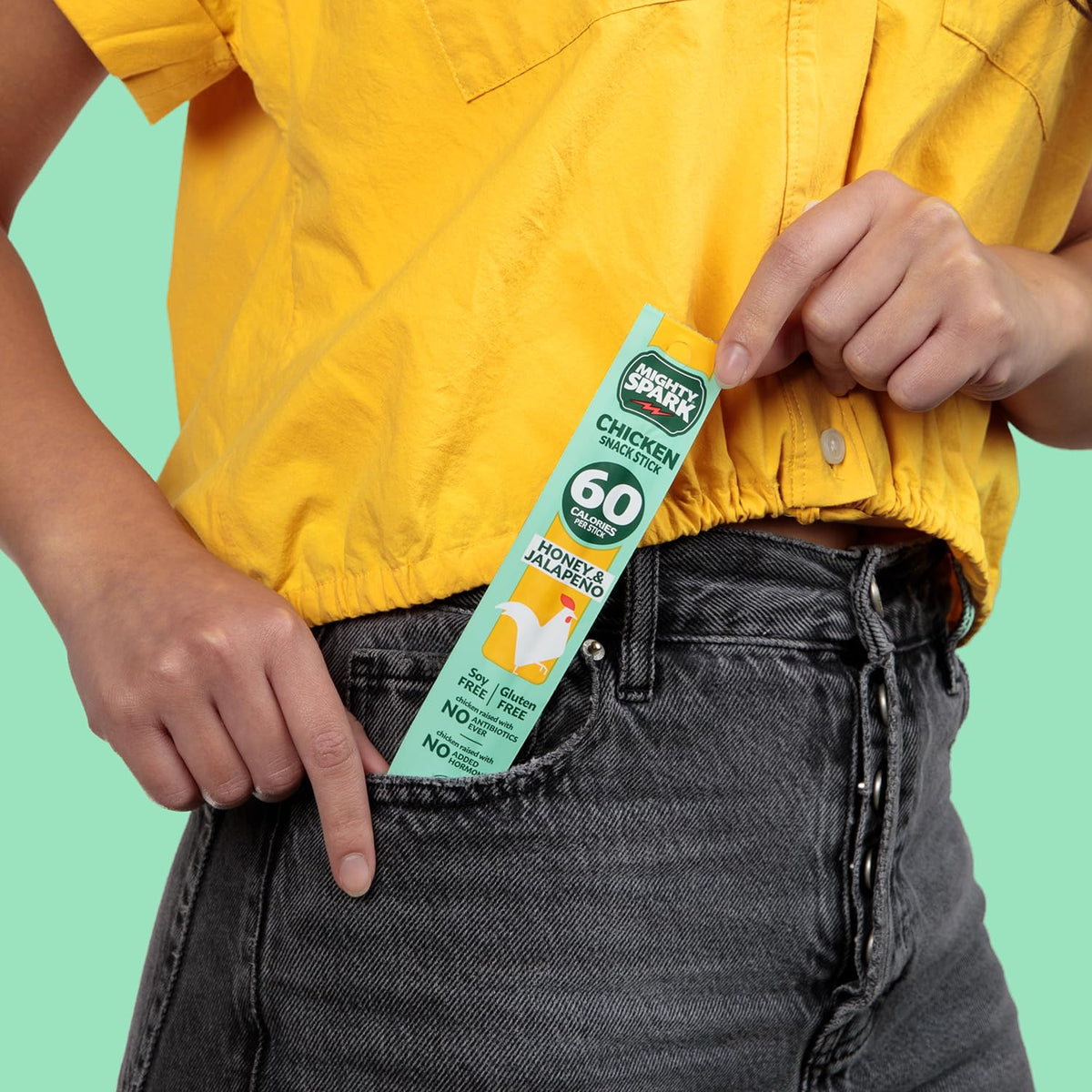 Mighty Spark Honey Jalapeno Chicken Stick in gym bag—no antibiotics, no nitrates.