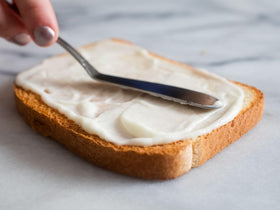 Mike’s Amazing Real Mayonnaise bottle pour demonstrates smooth spread on bread