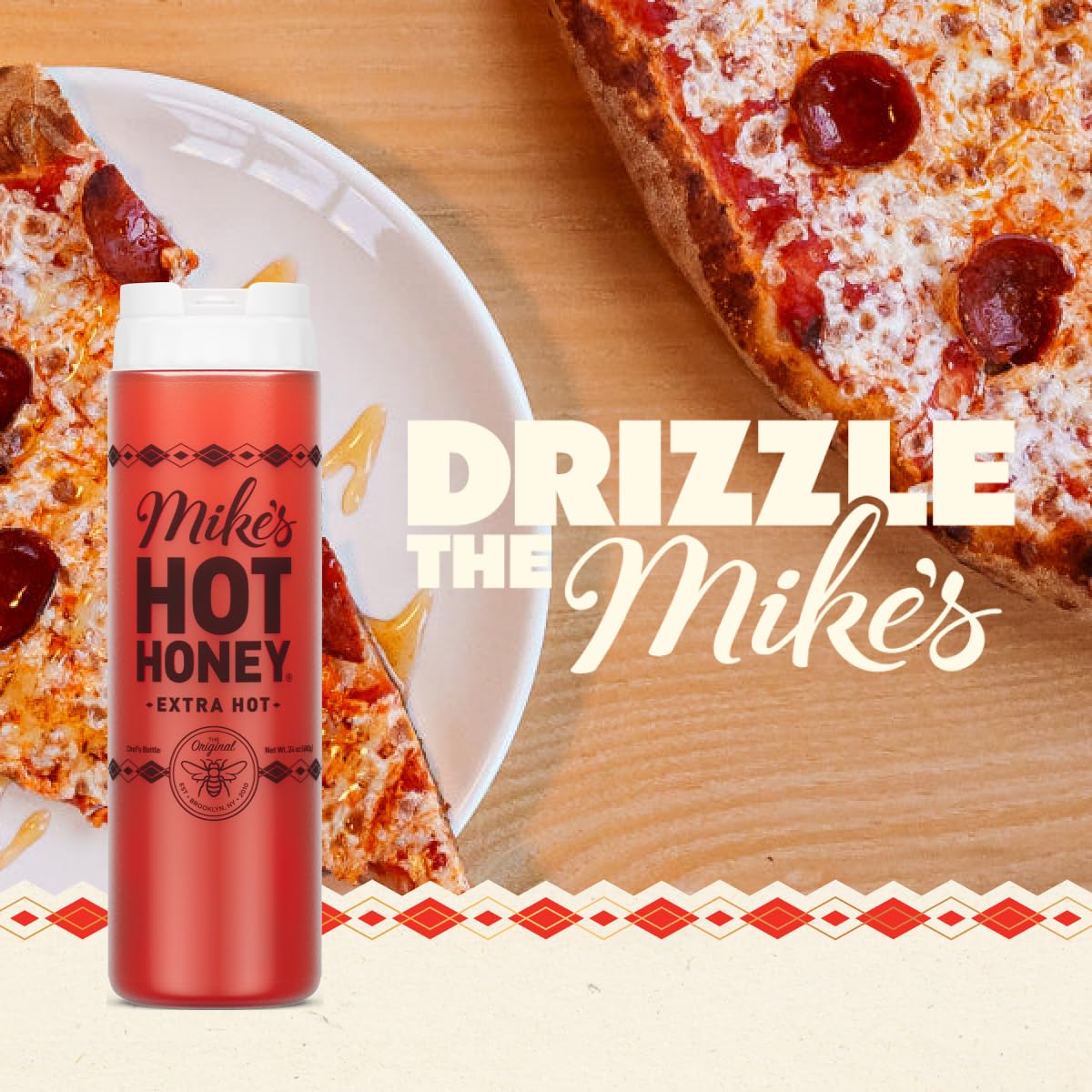 Mike's Hot Honey Extra Hot bottle pour illustrating easy drizzle for pizzas