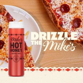 Mike's Hot Honey Extra Hot bottle pour illustrating easy drizzle for pizzas