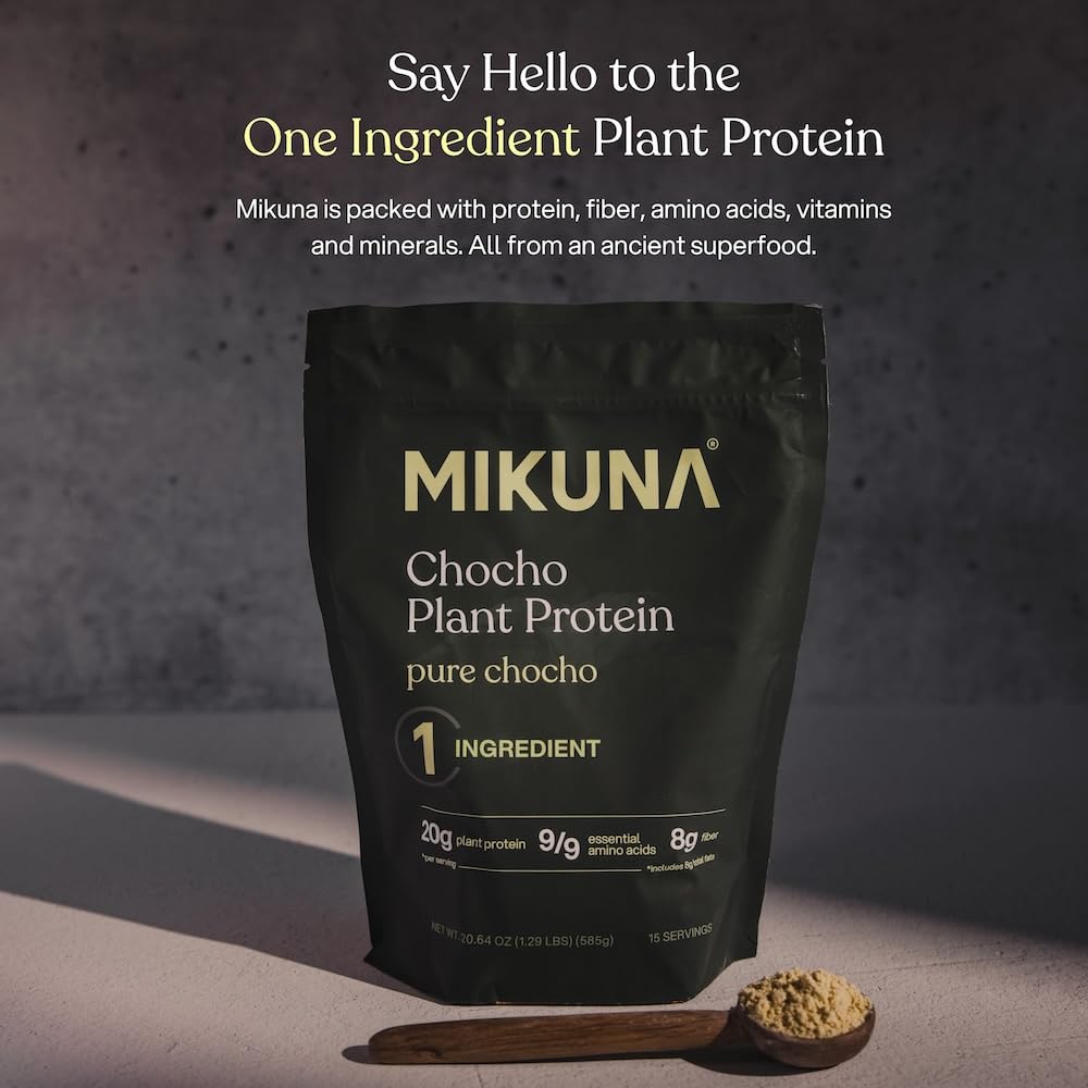 Mikuna Chocho protein powder scoop beside the container for easy serving of plant protein.
