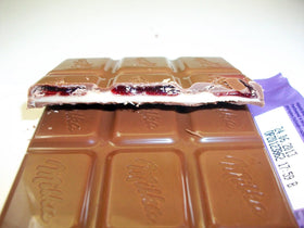 Milka vanilla cherry cream slice close-up shows texture.