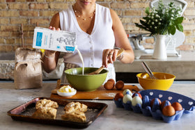 Milkadamia unsweetened macadamia milk 6-pack packaging shown.