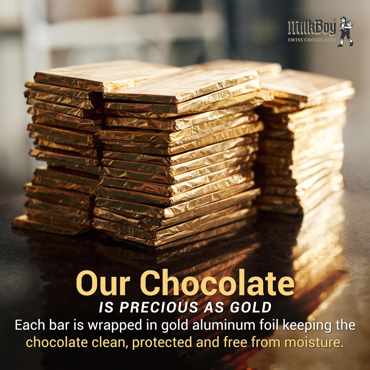 MilkBoy embossed design on chocolate bar held.