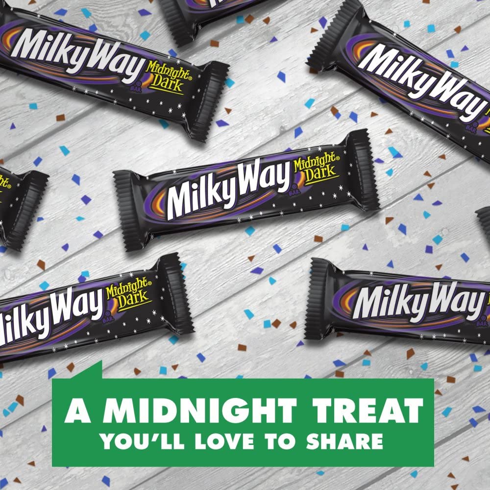 Cross-section shows nougat, caramel, and dark chocolate in Milky Way Midnight Dark.