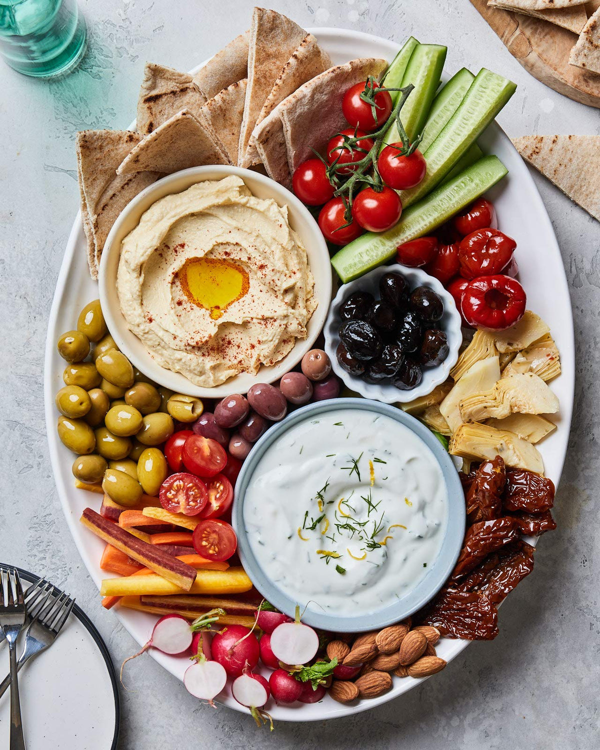 Appetizer platter featuring Mina olives for sharing.