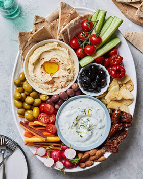 Appetizer platter featuring Mina olives for sharing.