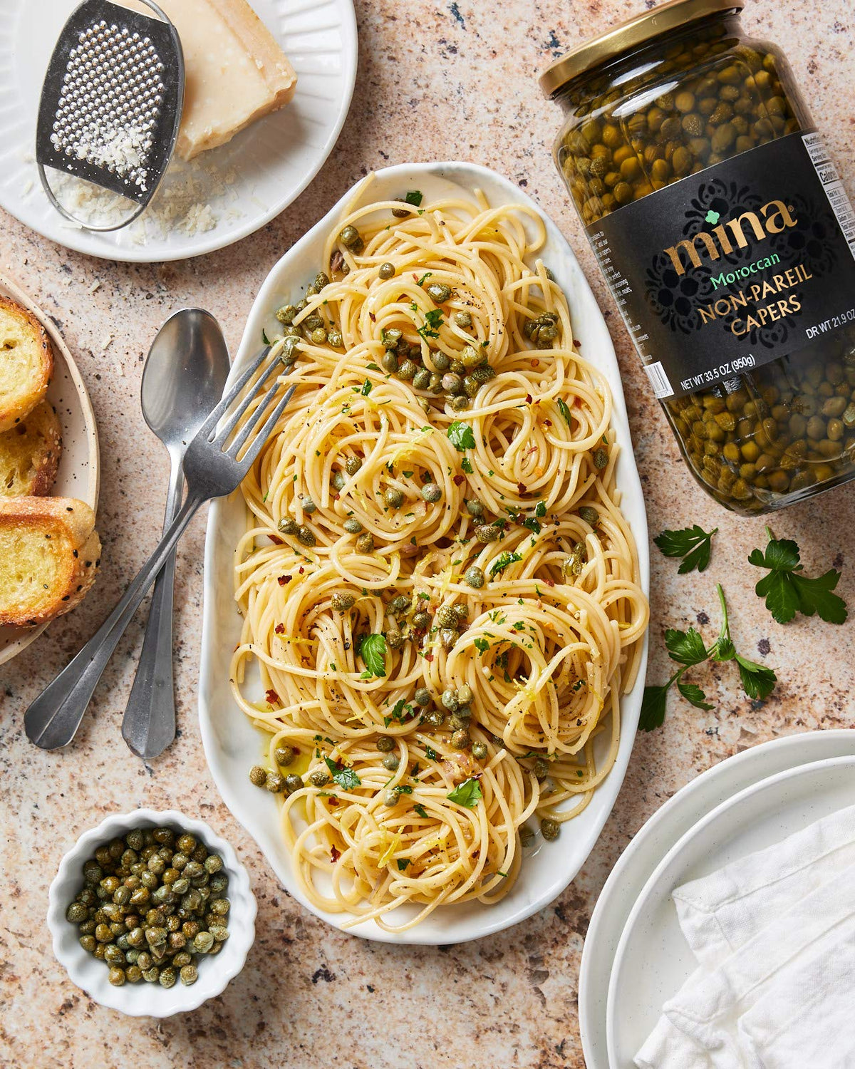 Mina Capers Non Pareil capers on a dish as a delicate seafood garnish.