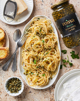 Mina Capers Non Pareil capers on a dish as a delicate seafood garnish.