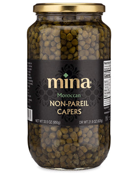 Mina Capers Non Pareil jar with emerald capers for versatile Mediterranean seasoning.