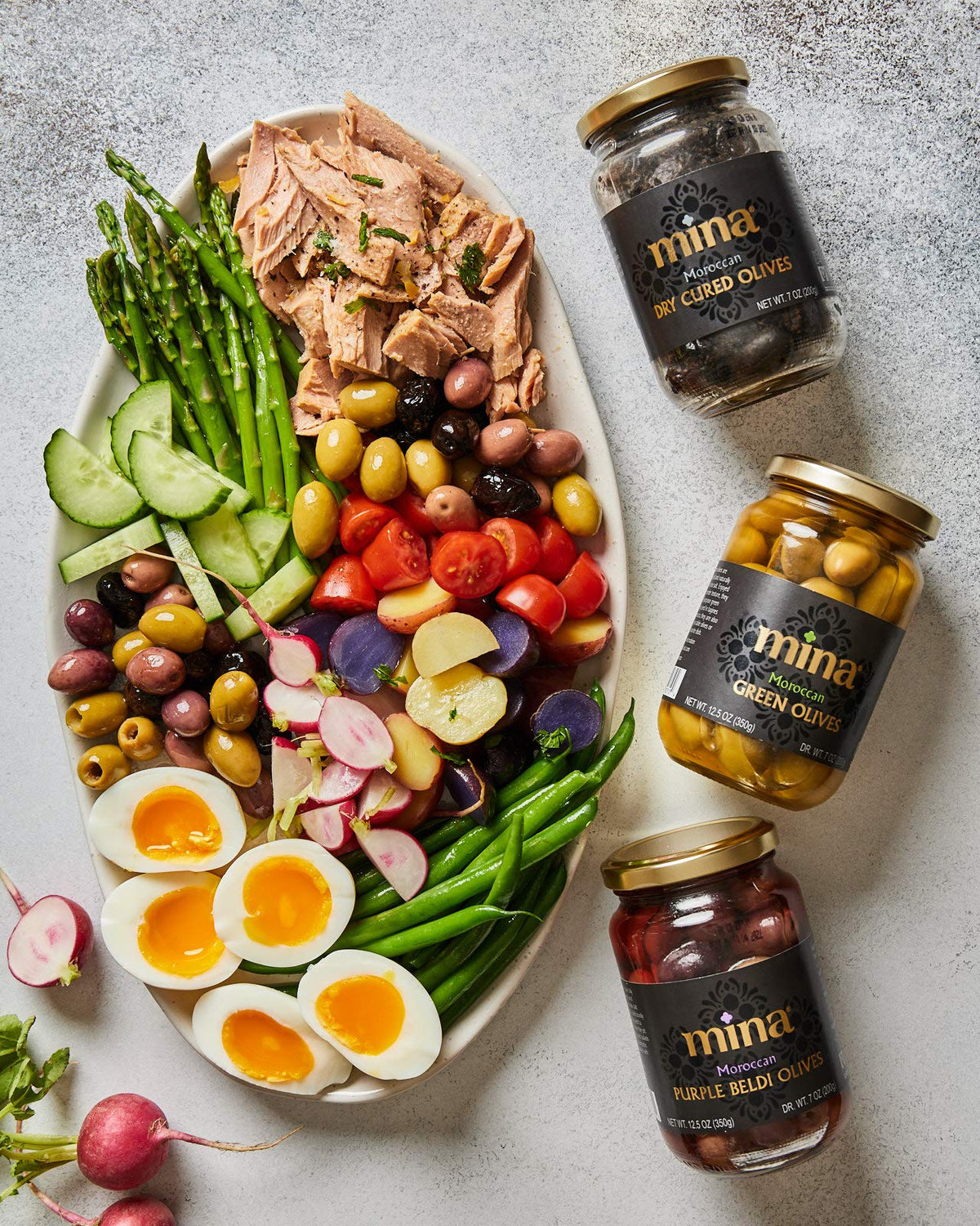 Close-up of Mina olives in olive oil cure, tender and flavorful, perfect as a snack or salad topper.