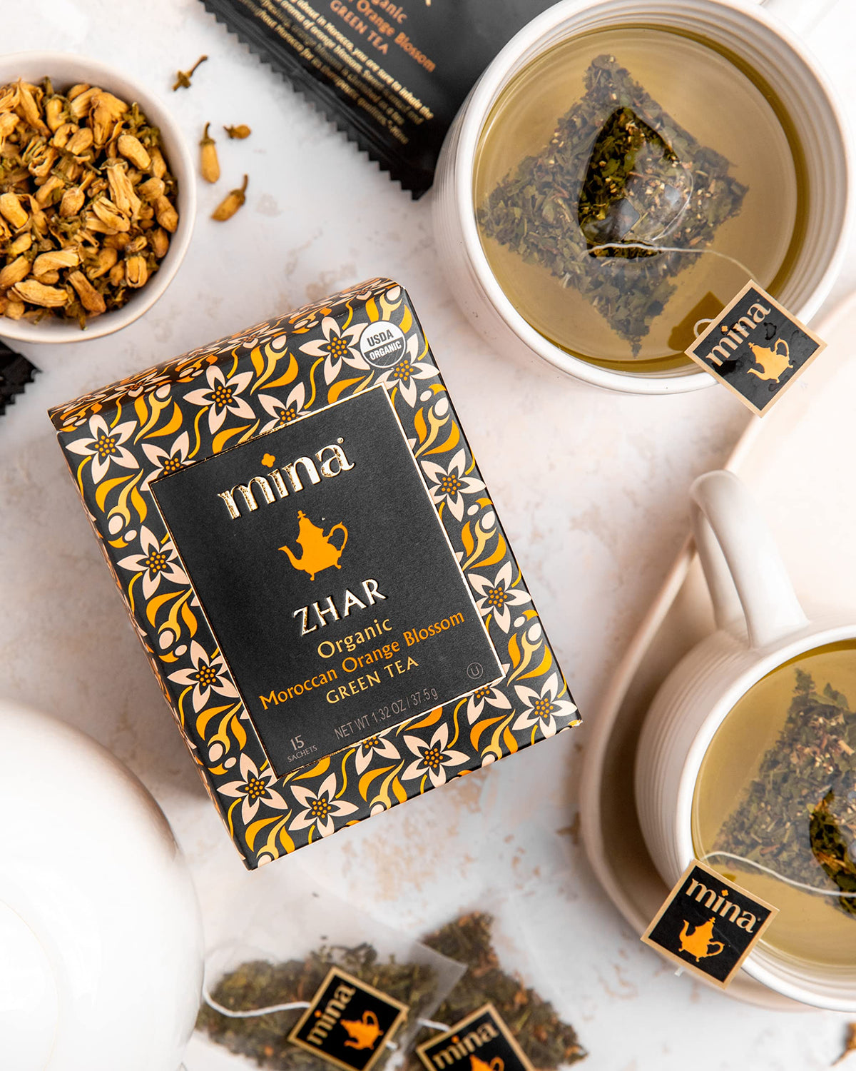 Mina floral citrus infusion visual suggests refreshing drink.