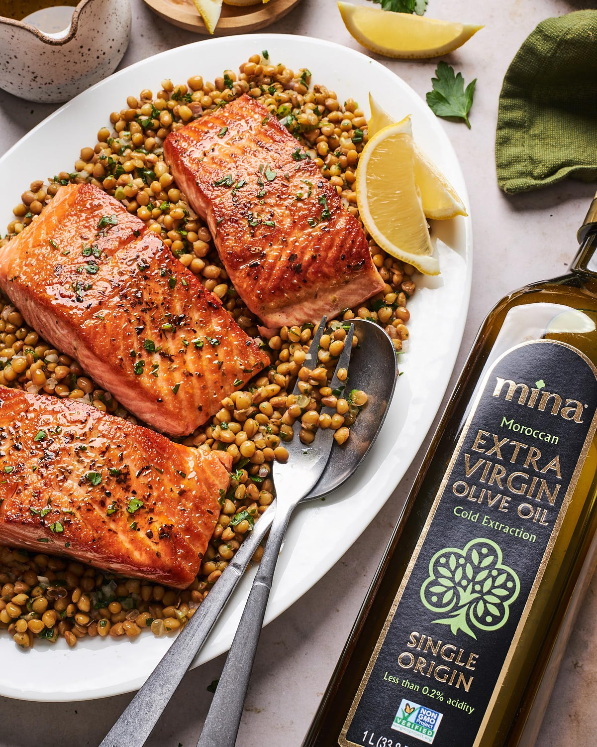 Close-up of olives and harvest imagery with Mina oil concept.